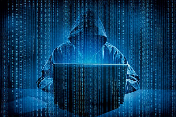 Hacker using laptop. Hacking the Internet.