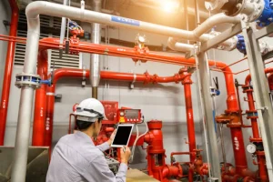 fire protection engineer inspecting fire pump