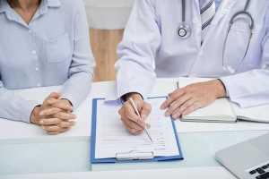 Board-certified physician reviewing workers compensation claim file for impairment rating dispute