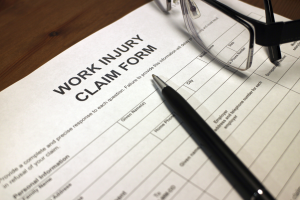 injured employee at workplace representing the workers compensation lawyer Roanoke VA injured workers need to navigate Virginia's workers compensation system