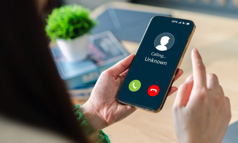 Human,Use,Smartphone,With,Incoming,Call,From,Unknown,Number,,Spam,
