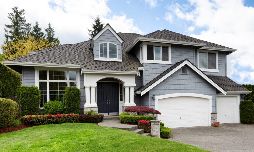 Clean home with healthy front yard during late spring season