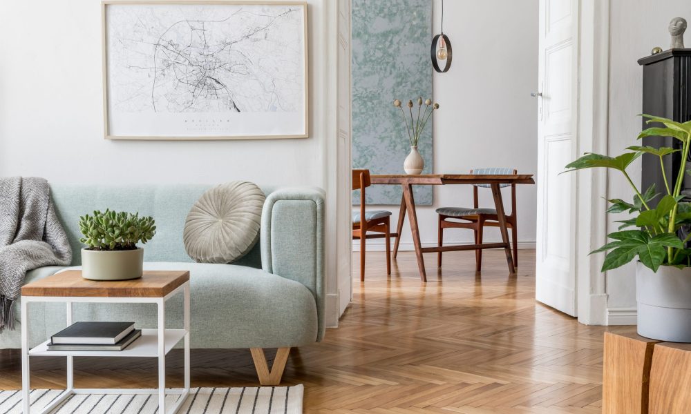 Stylish scandinavian living room with design mint sofa, furnitur