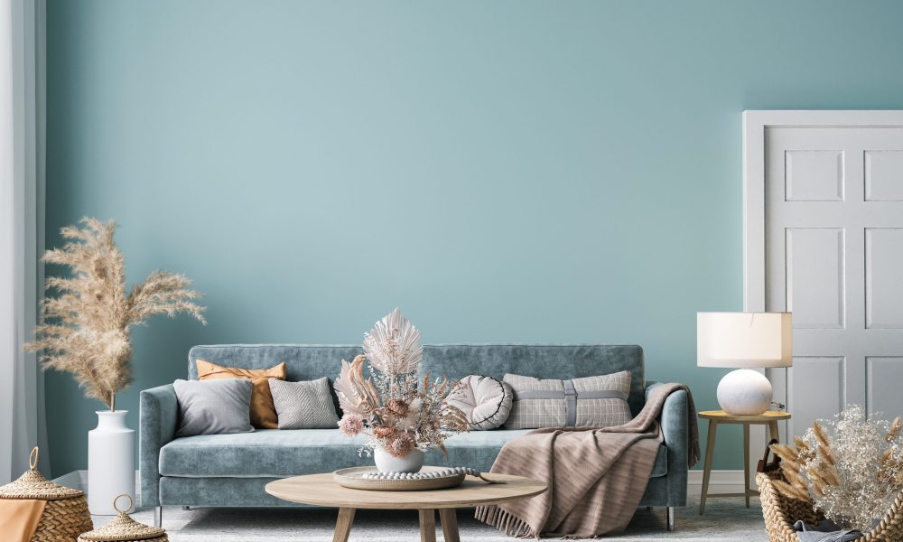 Home interior mock-up with blue sofa, wooden table and decor in