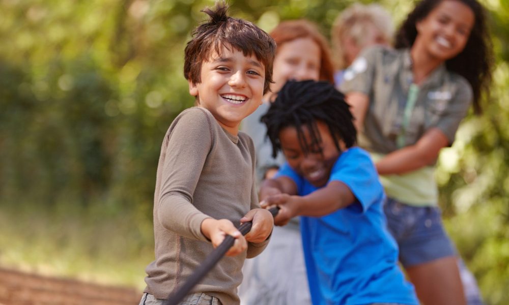 A group of kids in a tug-of-war game.