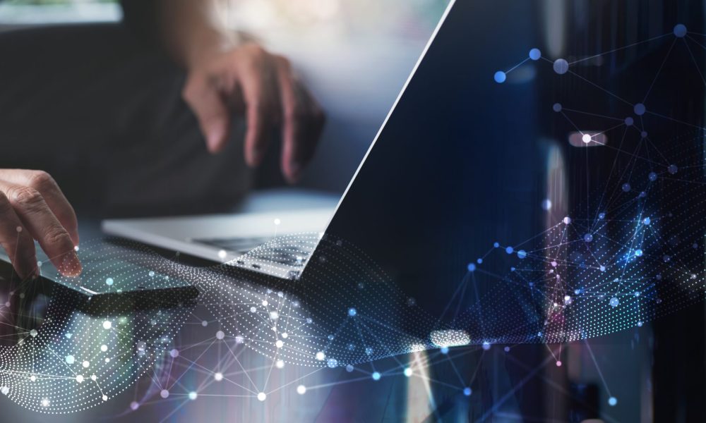 Digital technology, big data, internet network connection, futristic innovation technology background. Man using mibile phobe and laptop and smart city