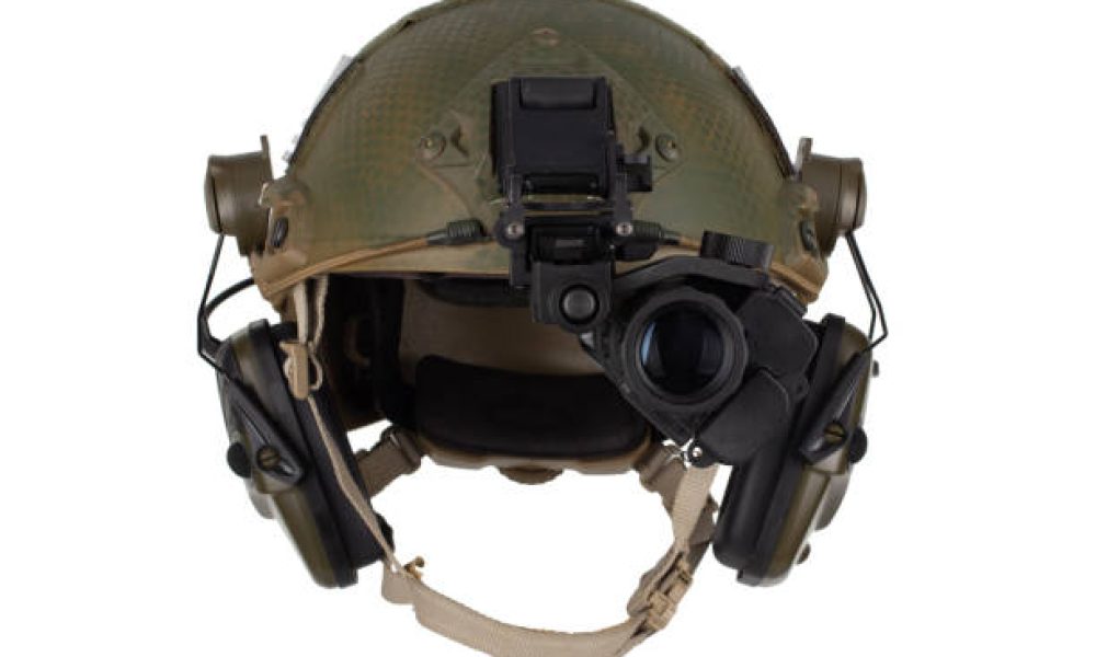 Night vision goggles on military helmet isolated on white background.