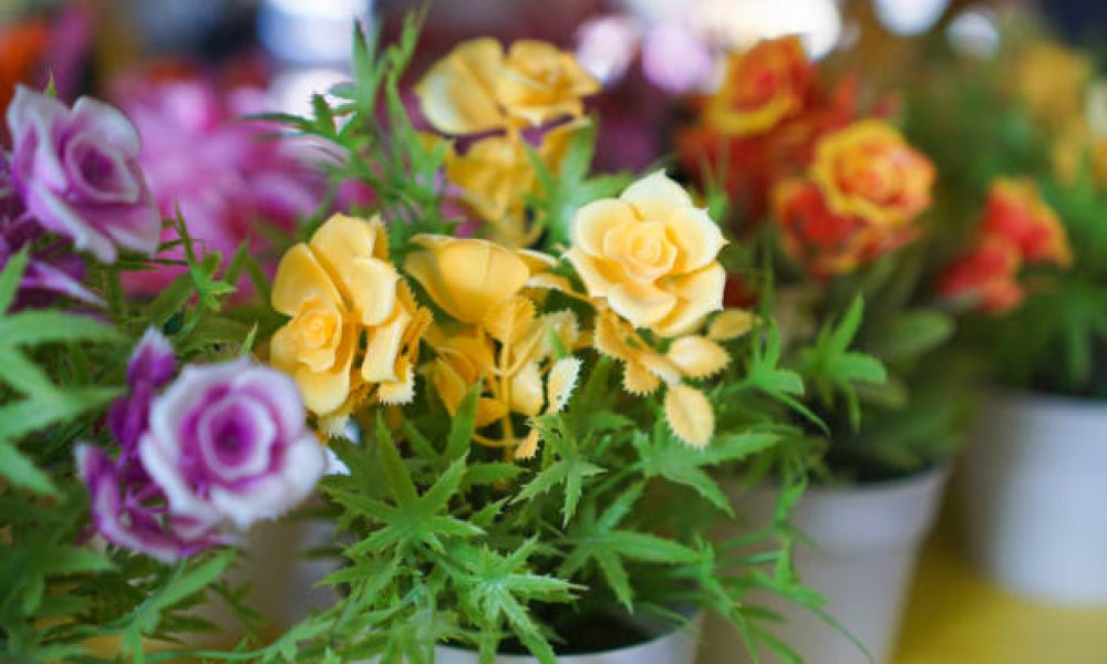 artificial blossom flowers in pot on shelf flower shop for home decoration made of acrylic