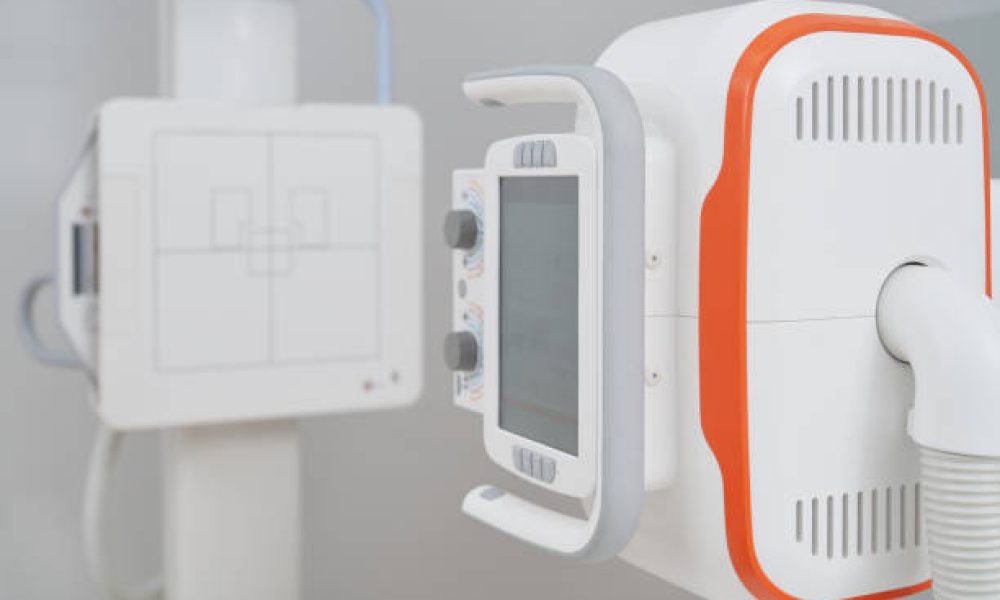 Close up of modern professional ultrasound equipment with digital screen and buttons. Ultra wave method of sonography and different diagnostic, lump, breast, hands, fingers. Concept of medicine.