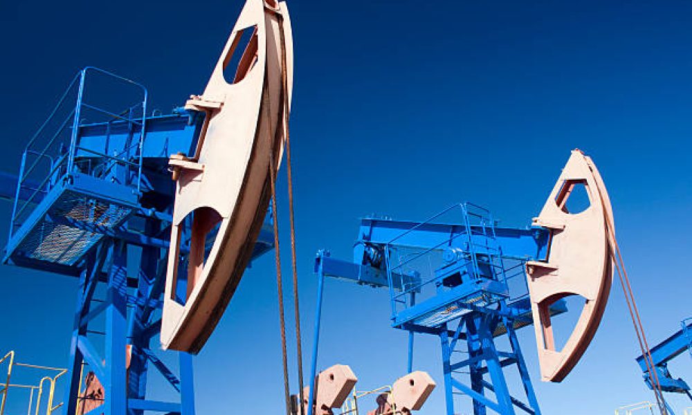 Oil and gas industry. Work of oil pump jack on a oil field. Wide Angle