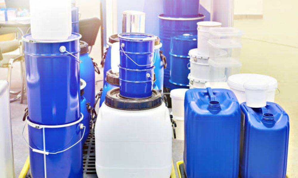 Metal and plastic containers for paint and water at the exhibition