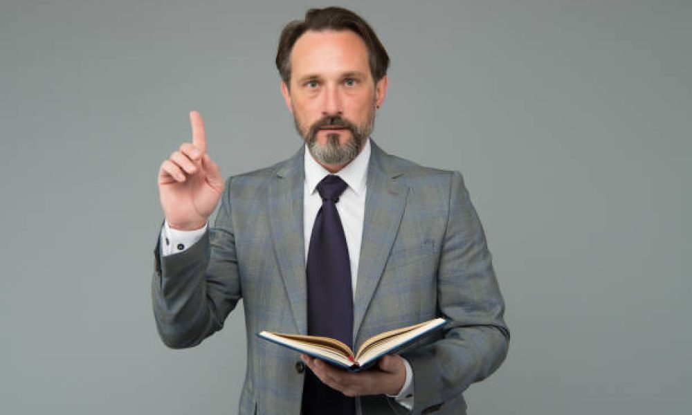 Business idea to start. Businessman hold book raising finger. Startup. Accounting business plan. Financial planning. Enterprise accounting. Market research. Copyediting and copywriting. Idea giver.