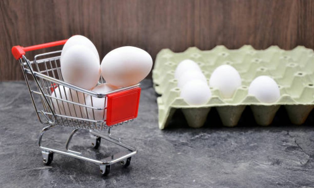 Eggs in the shopping cart close up photo