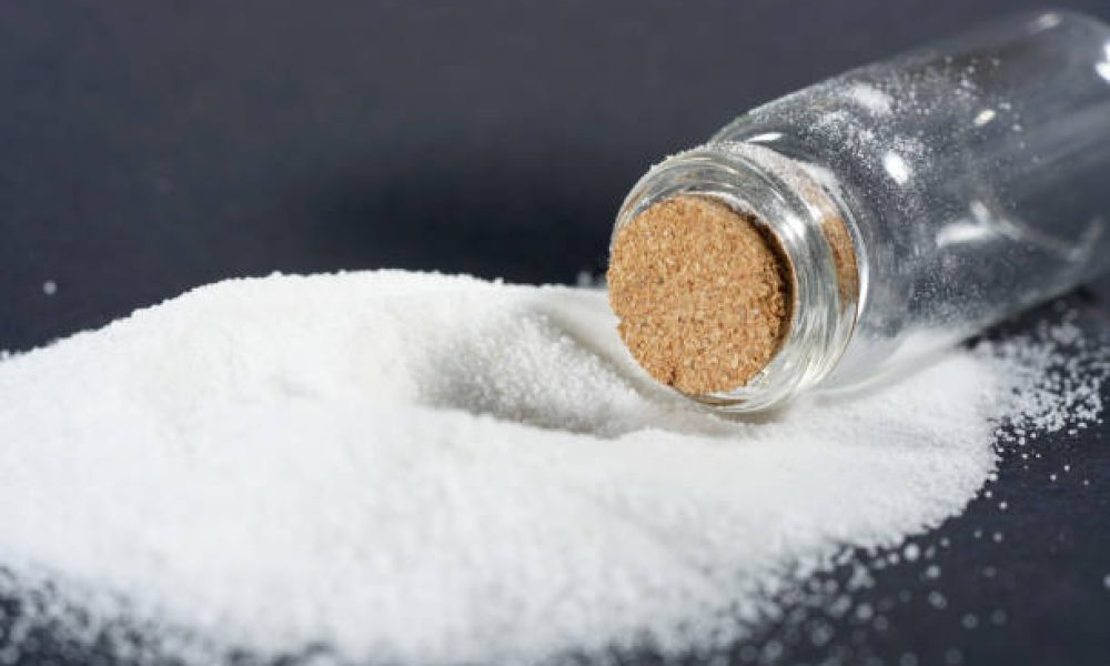 This is Makrogol powder photographed against a black background in the studio