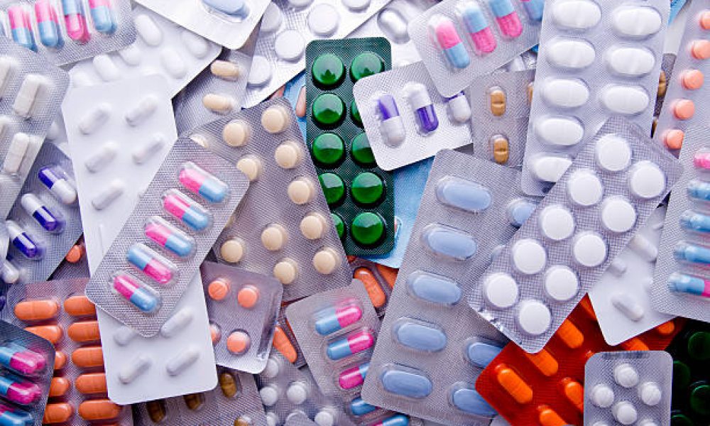 Colorful Assortment Of Medicine Tables & Capsules.
