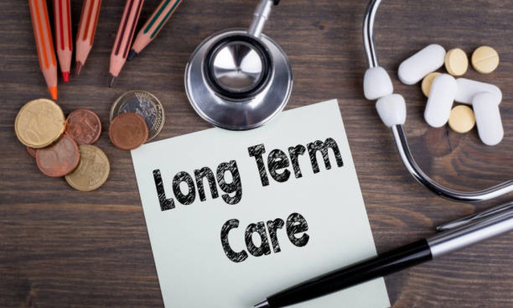 long term care concept. Desk with stetascope, money and tablets. background for medical care