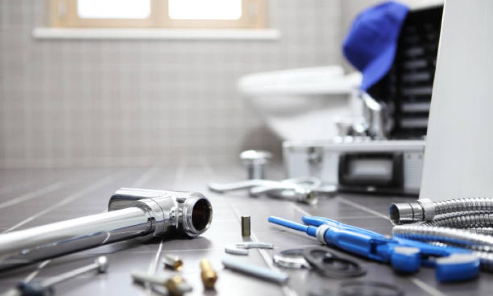 plumber tools and equipment in a bathroom, plumbing repair service, assemble and install concept