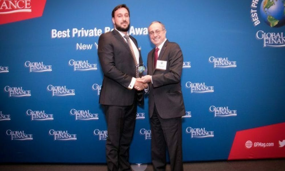 Luigi-Wewege-SVP-of-Caye-receiving-Best-Private-Bank-in-Belize-Award-for-2019-from-Global-Finance-publisher-Joseph-D.-Giarraputo-at-The-Harvard-Club-