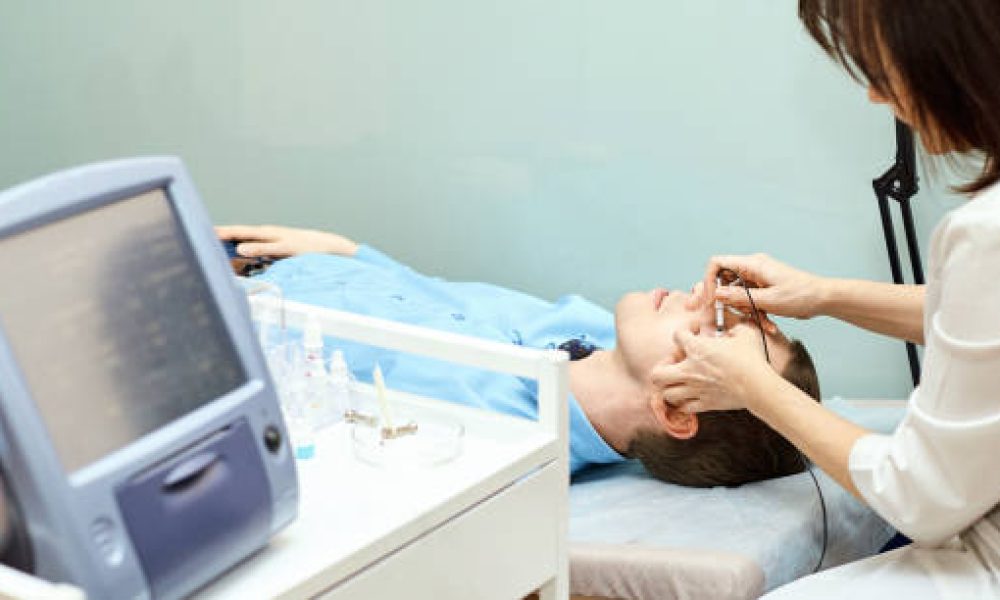 ophthalmologist doctor in exam optician laboratory with male patient. Men eye care medical diagnostic. Eyelid treatment.