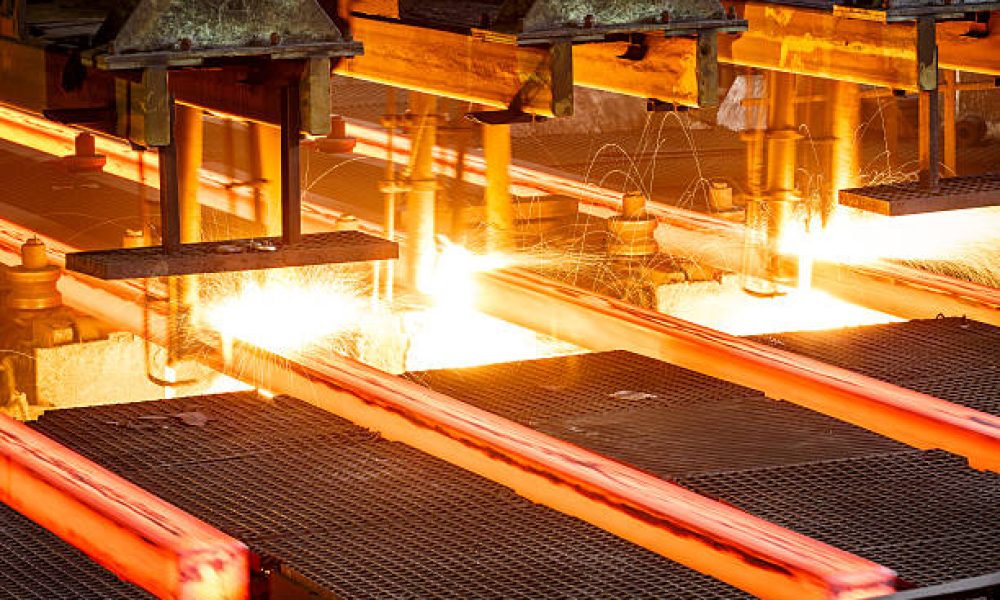 hot steel on conveyor Close shot in steel mill