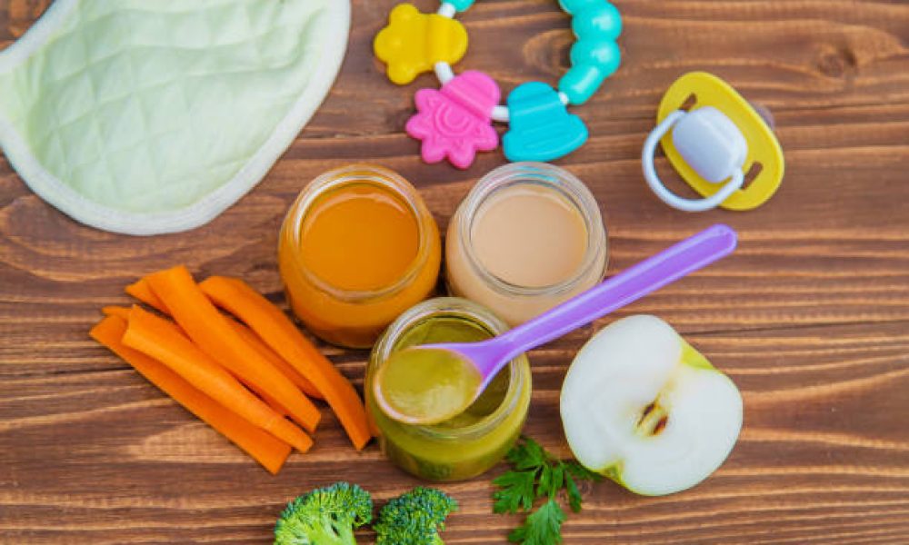 Baby food. Mashed vegetables and fruits in jars. Selective focus.