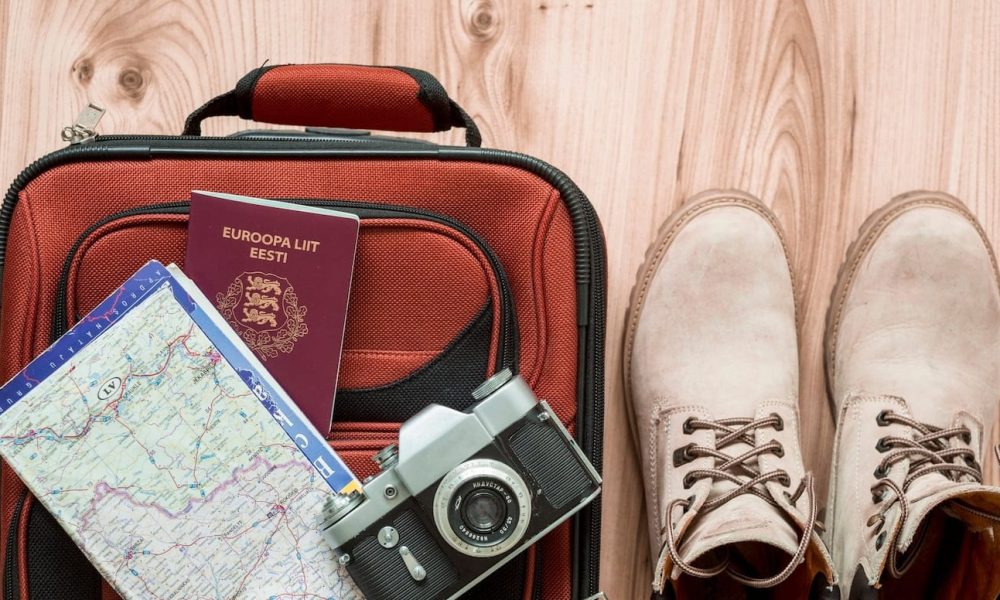 boots-near-tourist-supplies-suitcase_23-2147776881[1]