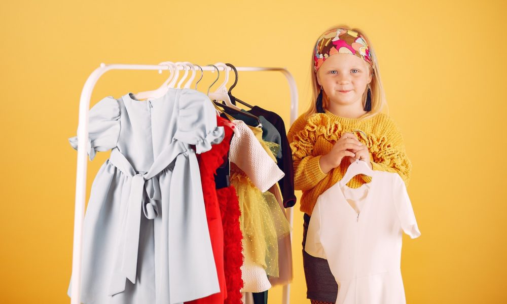 cute-little-girl-with-shopping-bags-yellow-background_1157-27840[1]
