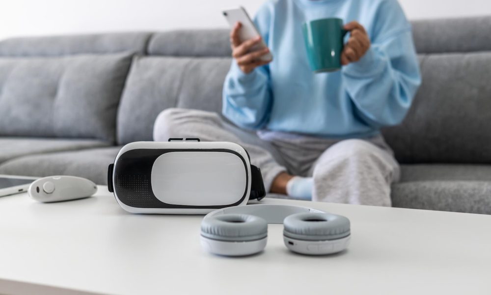 female-couch-holding-her-phone-mug-sitting-front-table-with-gadgets_181624-56360[1]