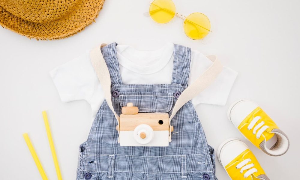 flat-lay-baby-clothes-with-photo-camera_23-2148251466[1]