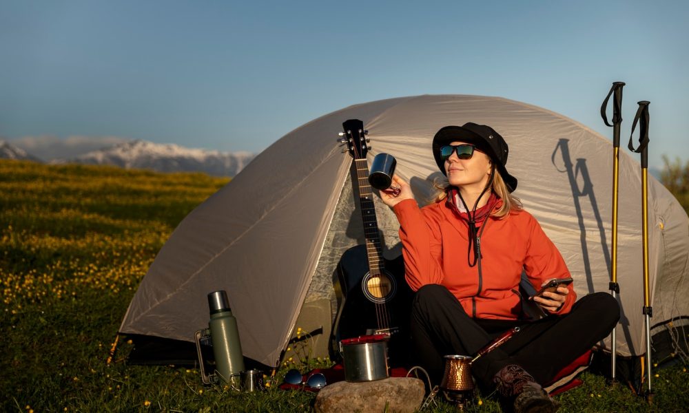 full-shot-smiley-woman-camping-with-tent_52683-88222[2]