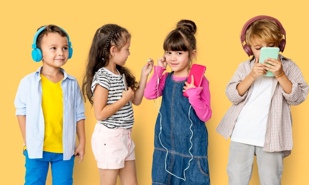 happiness-group-cute-adorable-children-listening-music_53876-137728[1]