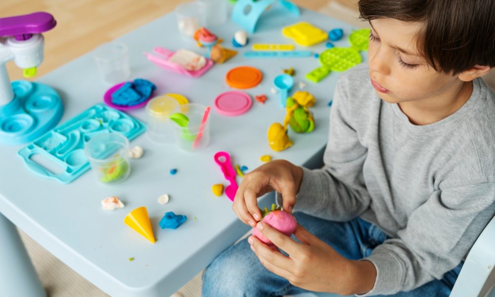 high-angle-kid-with-playdough_23-2149513119[2]
