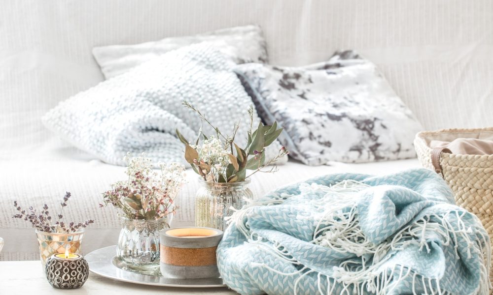 home-decorations-interior-turquoise-blanket-wicker-basket-with-vase-flowers-candles_169016-3371[1]
