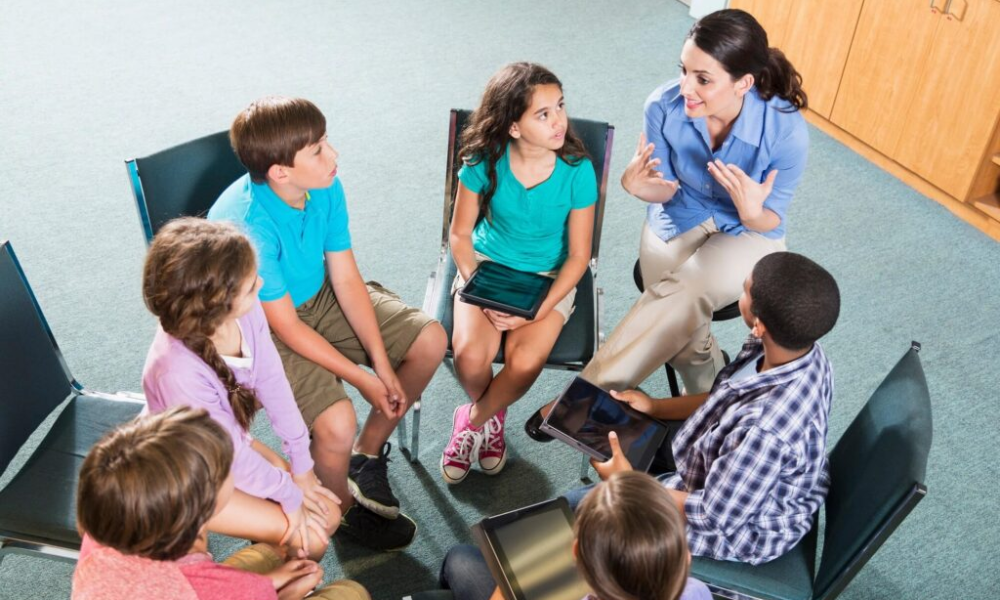 Teens practicing conversation skills in a structured social skills groups program