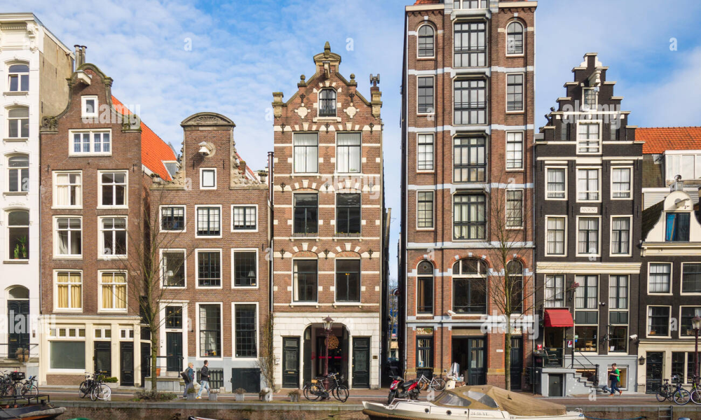 Amsterdam Netherlands canal houses representing the Dutch real estate and property market for international buyers