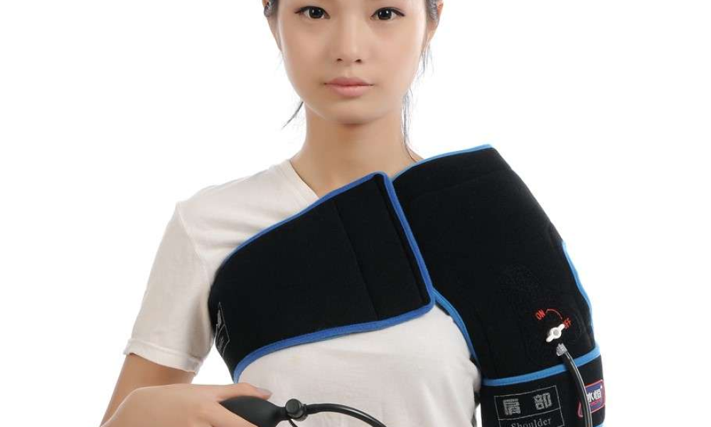orthopedic cold compression wrap applied to shoulder for post-surgical pain and swelling management during recovery