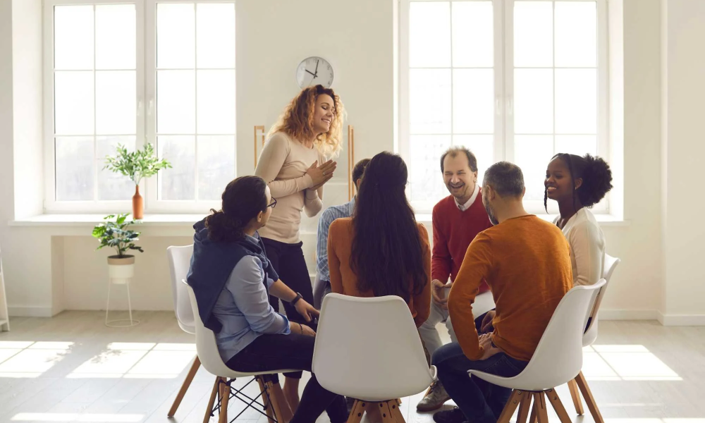 adults participating in a structured group therapy session to build communication skills and reduce social anxiety