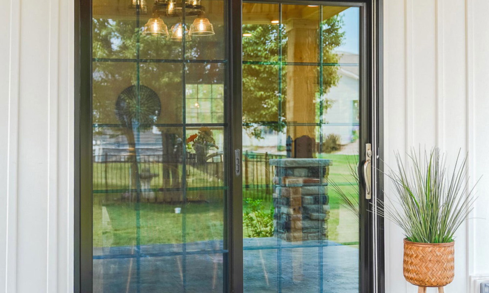 modern vinyl replacement windows installed on a residential home exterior as part of a coordinated vinyl windows and doors residential upgrade