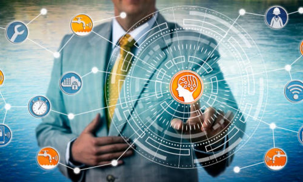 Unrecognizable industrial manager monitoring a smart water grid via artificial intelligence and IoT connectivity. Technology and industry concept for internet of things and intelligent water network.