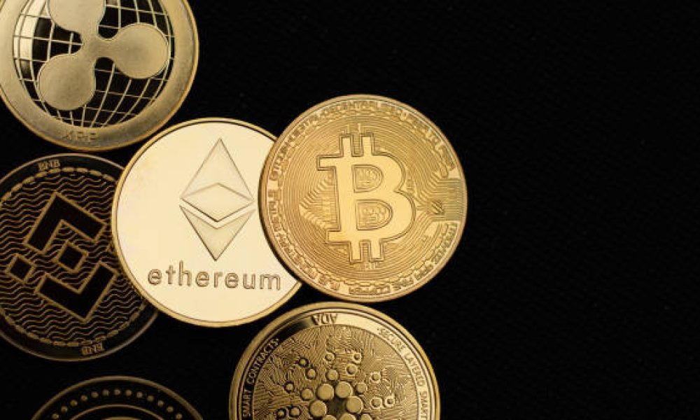 São Paulo, Brazil - Circa February 2022: Cryptocurrency golden coins in close up. Bitcoin, Ethereum, Binance.