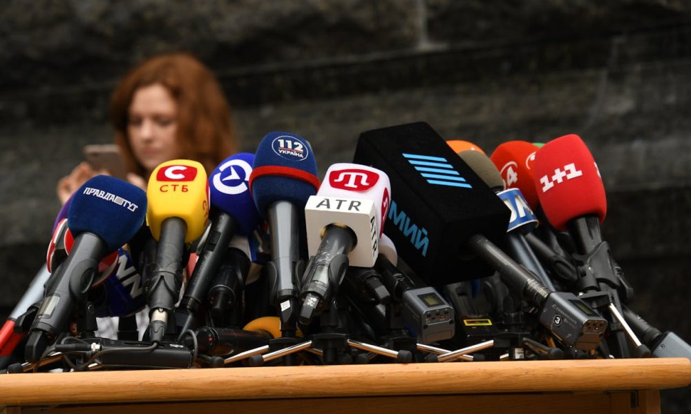 Photo Credit: https://www.pexels.com/photo/microphones-on-desk-at-press-conference-15920138/
